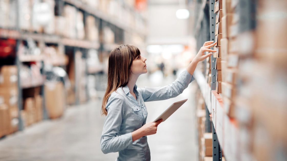 A worker checking stock levels