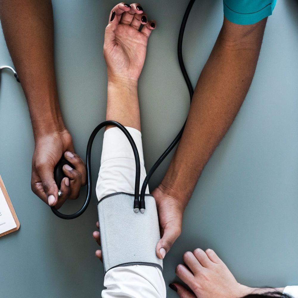 Doctor checking the pulse of a patient